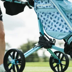 Image of BagBoy Nitron Auto Open Push Cart Ice Blue and White on Golf Course Closeup